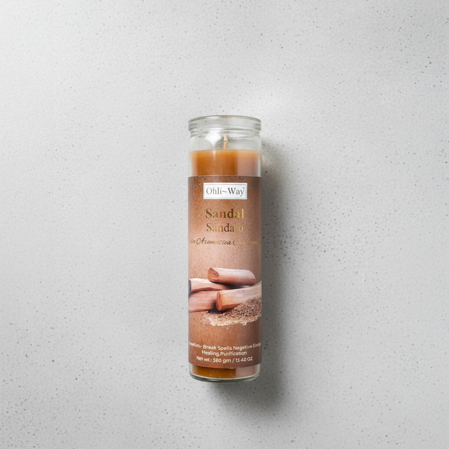 Candle in a glass jar with sandalwood fragrance on a gray background