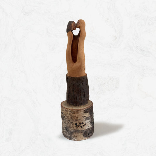 Open Palette handcrafted romantic art piece terracotta couple embracing on rustic wood stump base
