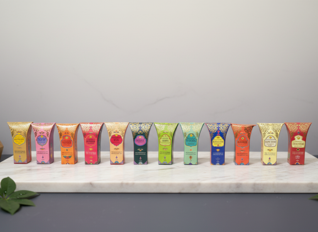 Row of colorful oil products on a marble surface with a gray background