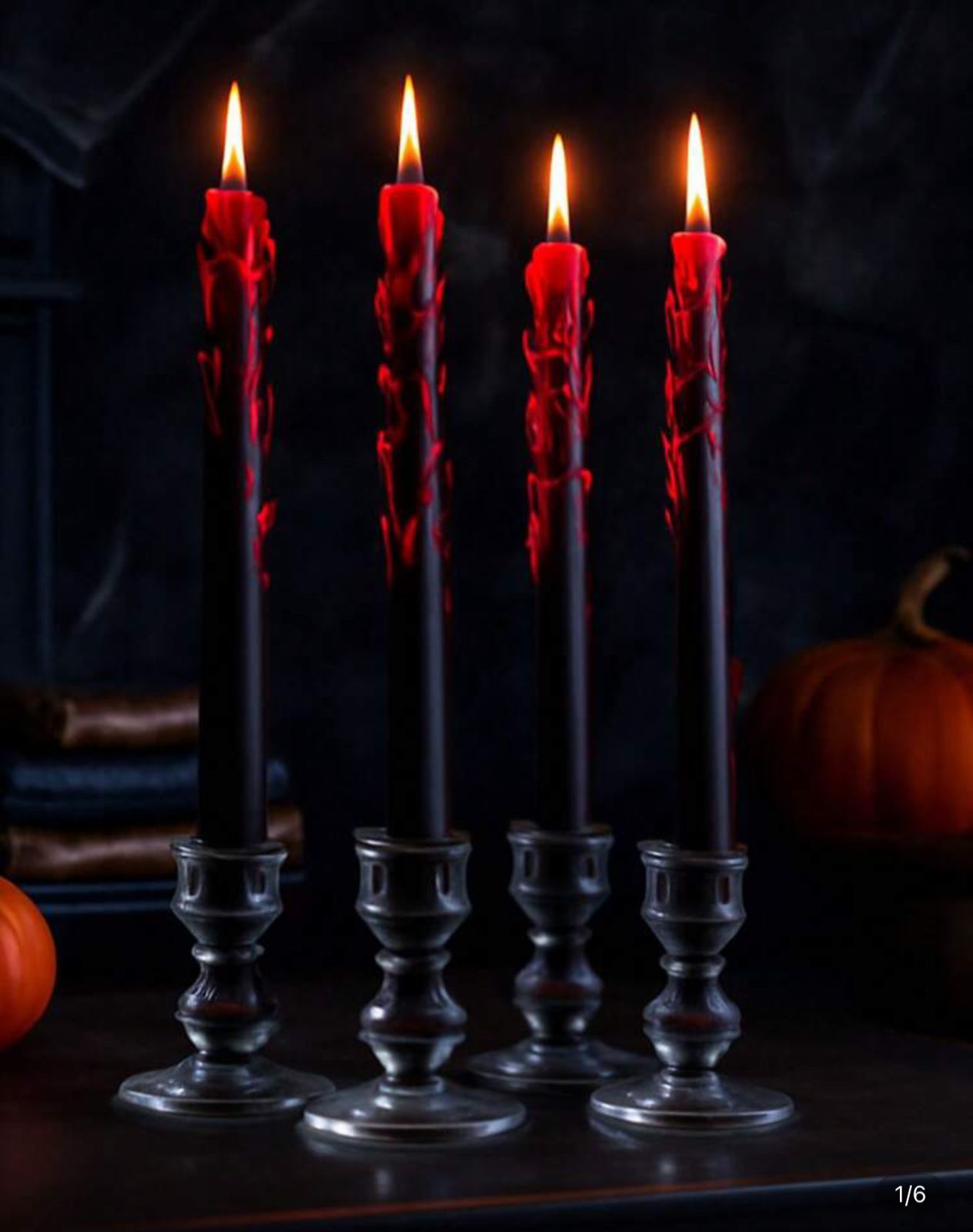 Five black candles with red wax dripping into clear glass holders on a dark background.